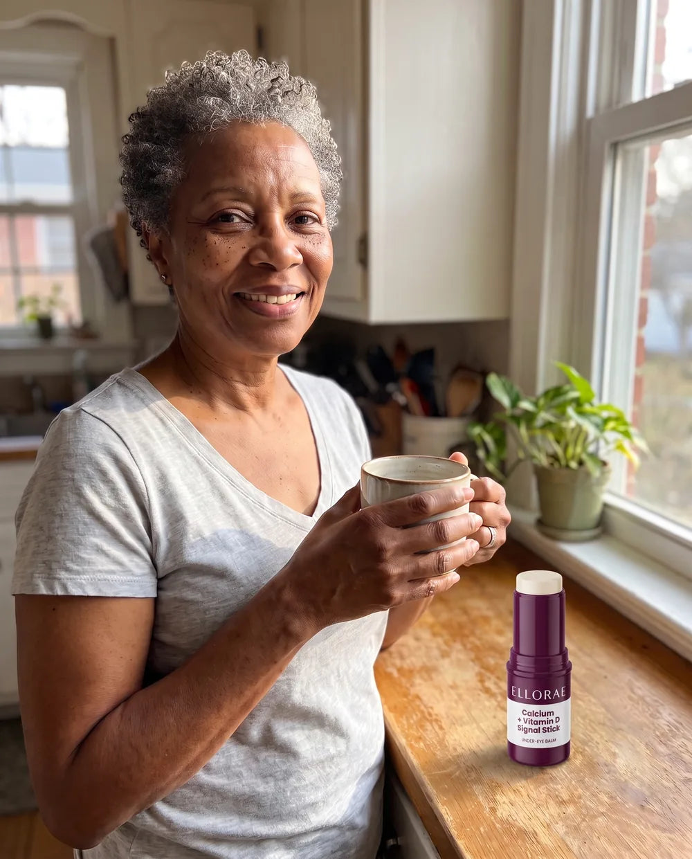Woman around 60 looking rested in morning light after her balm swipe